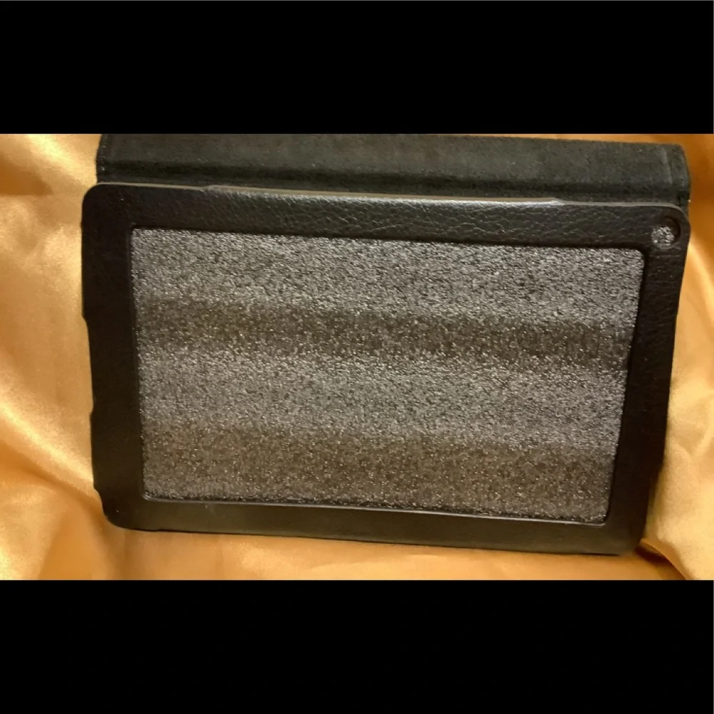 Black tablet cover, Magnetic closure, Measures @ 7 1/2” x 5”, NWT